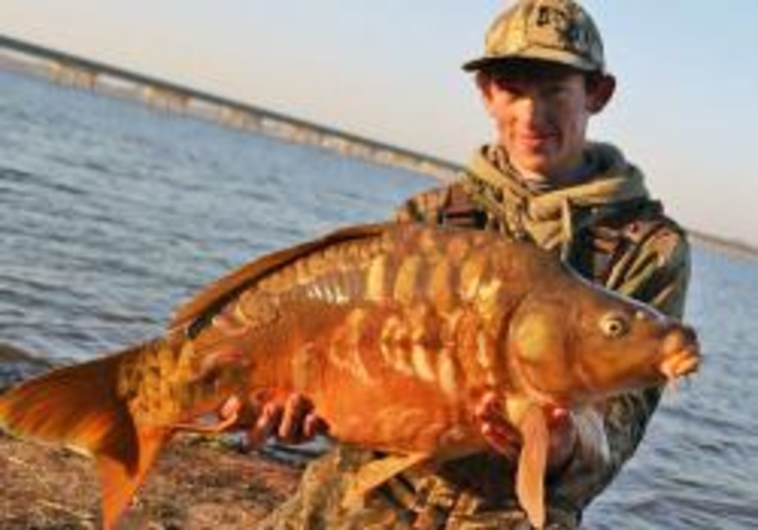 2014 is here, and Lake Fork is already producing astonishing fish. Pictured here is Austin Anderson with a beautiful mirror carp he caught on the lake on Jan 2.