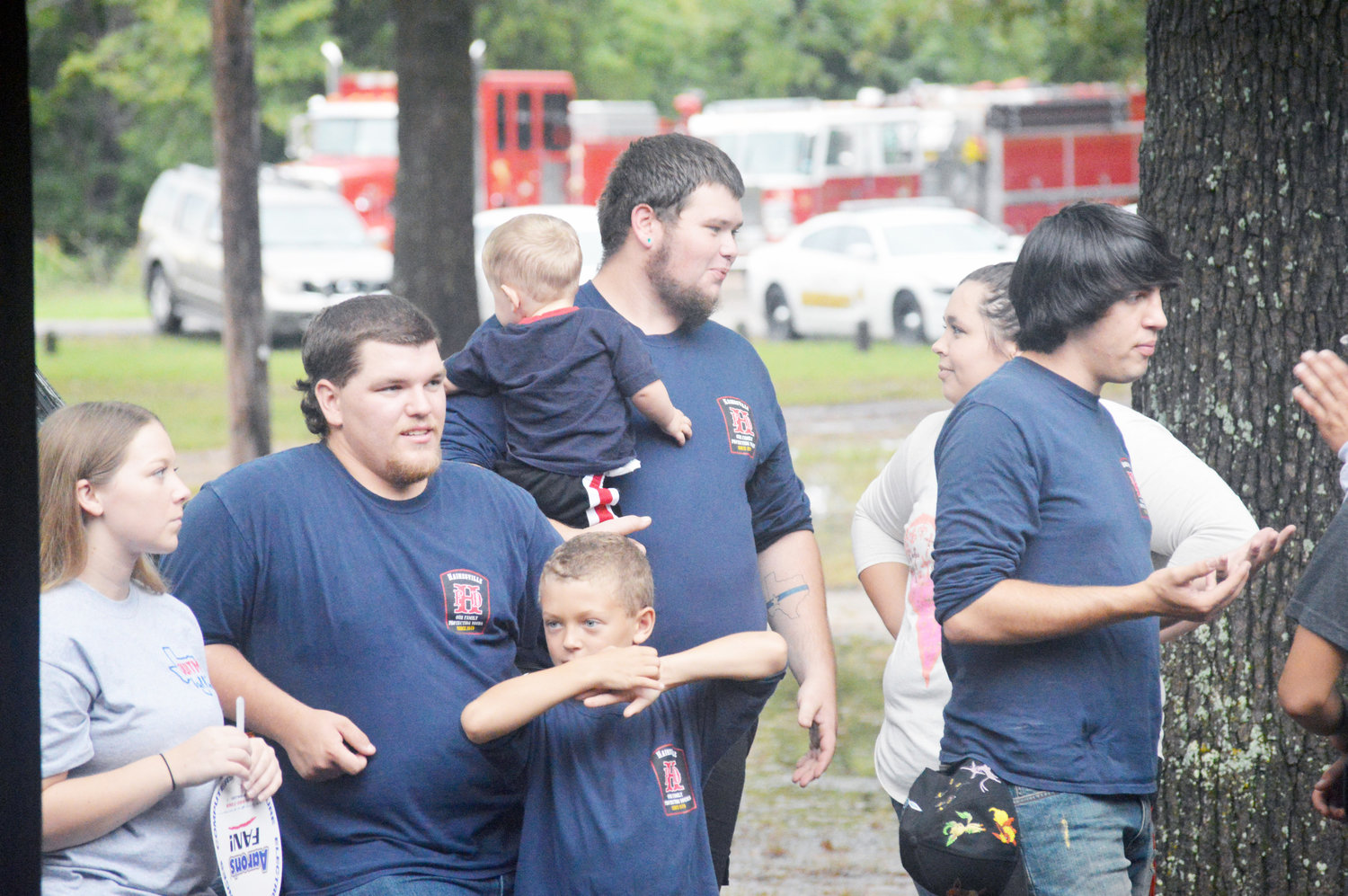 Members of the Hainesville Volunteer Fire Department are shown here with family members at the appreciation cook-out held at Jim Hogg City Park in Quitman Thursday evening.