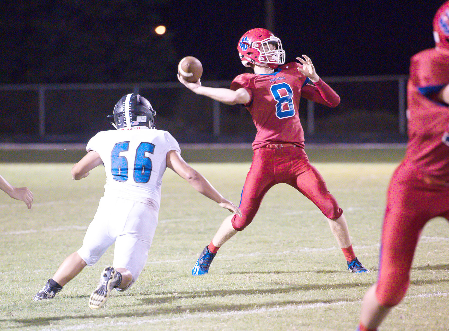 Senior Cody Frazier drops back for a pass in Alba-Golden’s loss to All Saints. (Photo by Chad Parrish)