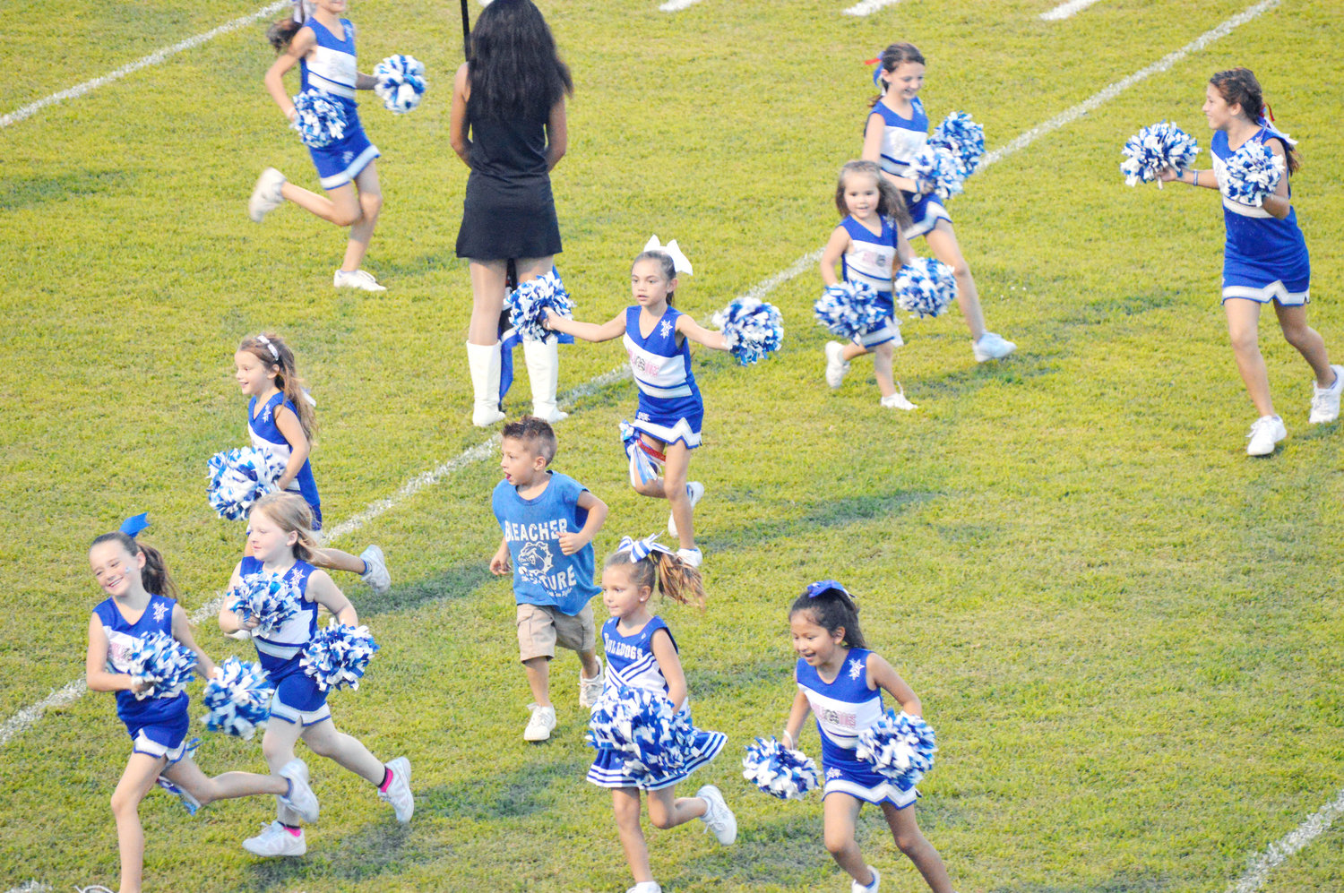 This young Bulldog had a great time among the peewee cheerleaders as they ran on the field homecoming night.