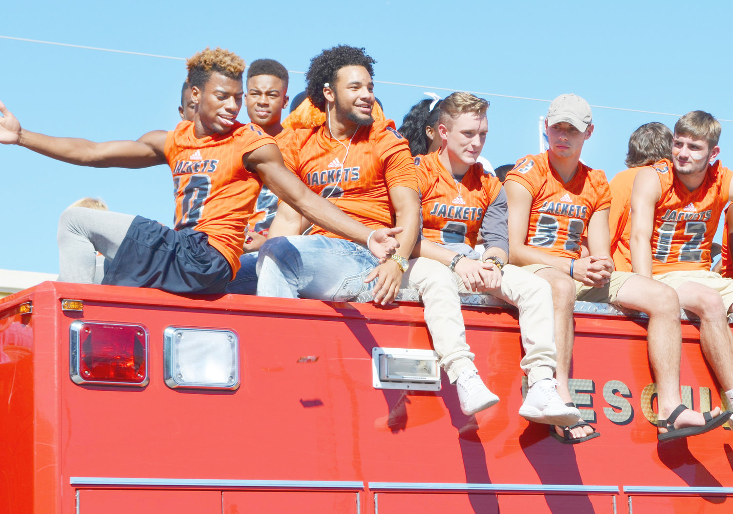 From left, Kartney Hampton, Jeremiah Crawford, Chantz Perkins, Dalton Harris and Frankie Meason enjoy their Friday afternoon during the homecoming parade as they ride a fire truck through downtown Mineola.