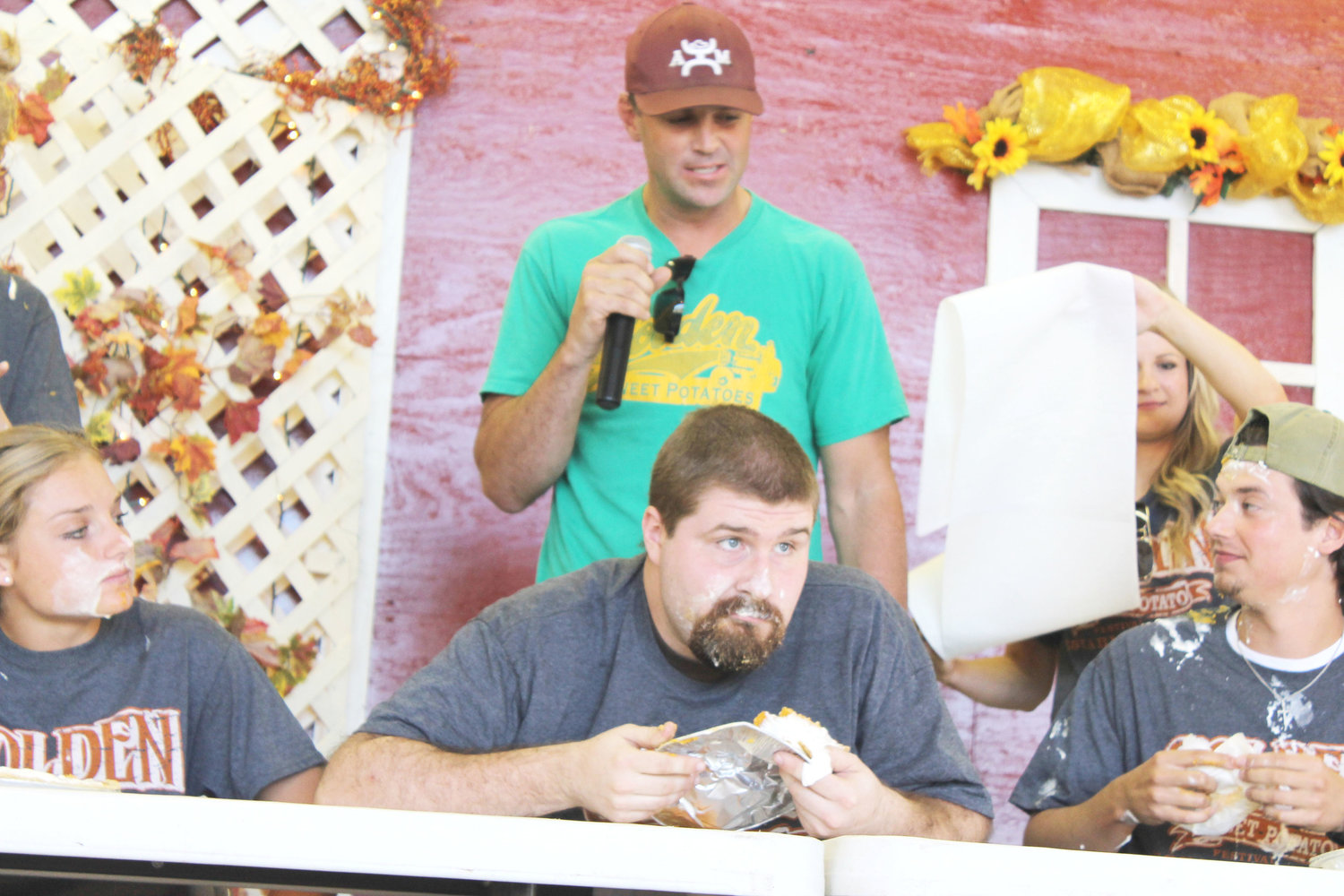 Clint Bittner devoured the sweet potato pie before any of his competition in Saturday’s Pie Eating Contest. It was a messy affair and contestants didn’t get to use forks but Bittner out-distanced the competition. To his left is Caitlin Lennon, and his right is Blake Hambrick. Behind him is coordinator of the event, Grant Sadler.