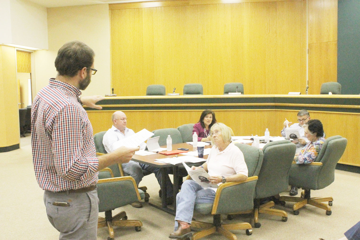 Hunter Rush of MHS Planning & Design, LLC, went over the highlights of the Parks and Open Spaces Master Plan at the Mineola City Council workshop Thursday. Listening at the council table were Kevin White, alderman  Ward 2; City Administrator Mercy Rushing; Mayor Rodney Watkins; Sue Jones, councilperson Ward 1 and Jayne Lankford, Ward 2, councilperson.
