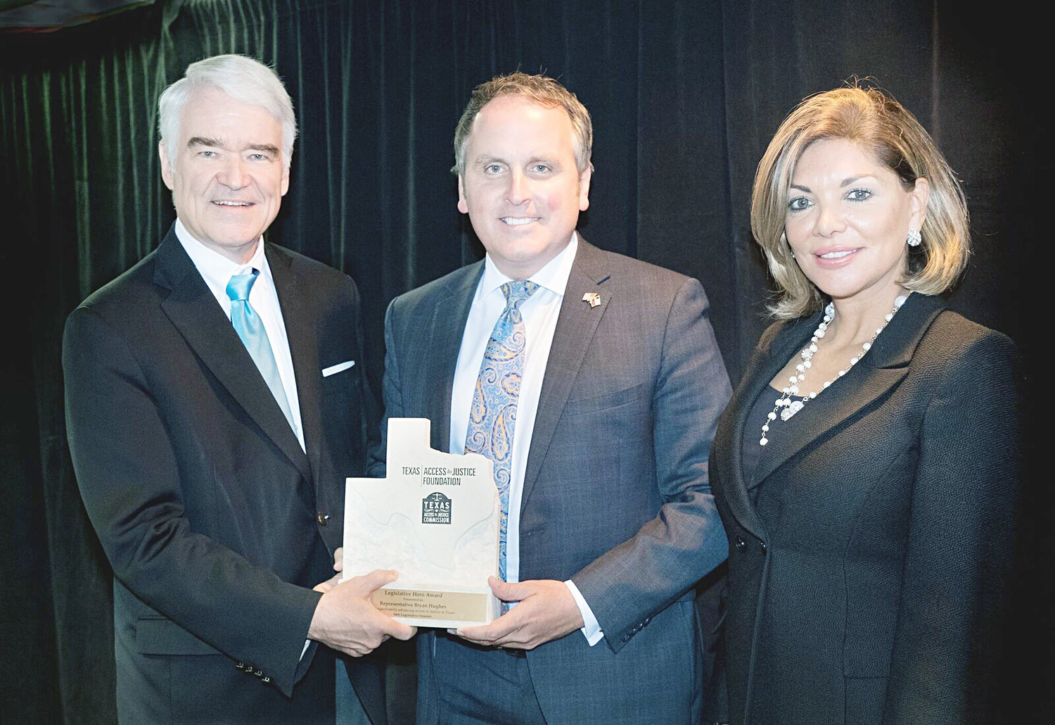 From left, Chief Justice of the Texas Supreme Court Nathan L. Hecht presents Representative Bryan Hughes with a Legislative Hero Award from the Texas Access to Justice Foundation along with Justice Eva Guzman. Hughes was selected for this honor due to his dedication to helping low-income Texans get access to the justice system. 