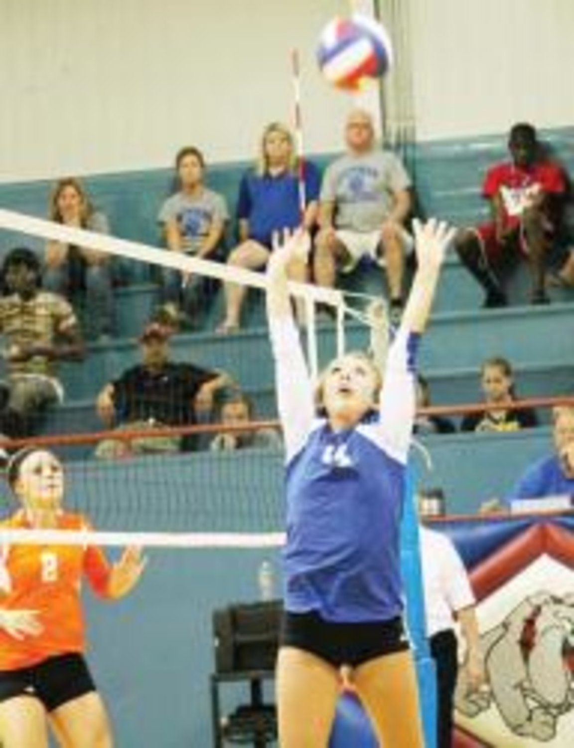 This Lady Bulldog stretches to keep the ball from hitting the floor in this file photo from the team's Aug. 27 game against Mineola.