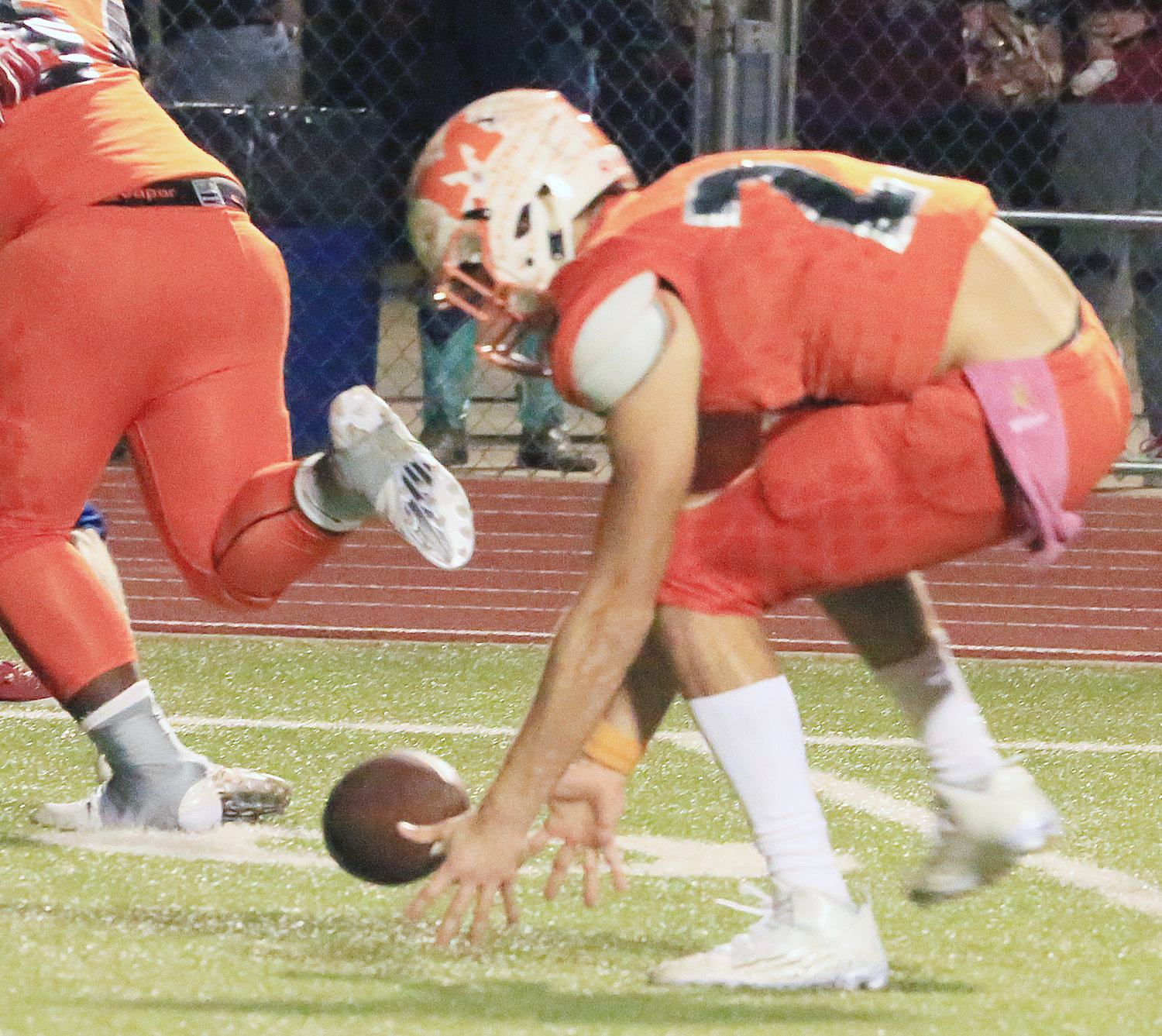 Devon Goguen (23) scoops up a fumble at the end of the first quarter. He would return it for a touchdown to give Mineola a 28-0 lead against the Sabine Cardinals.