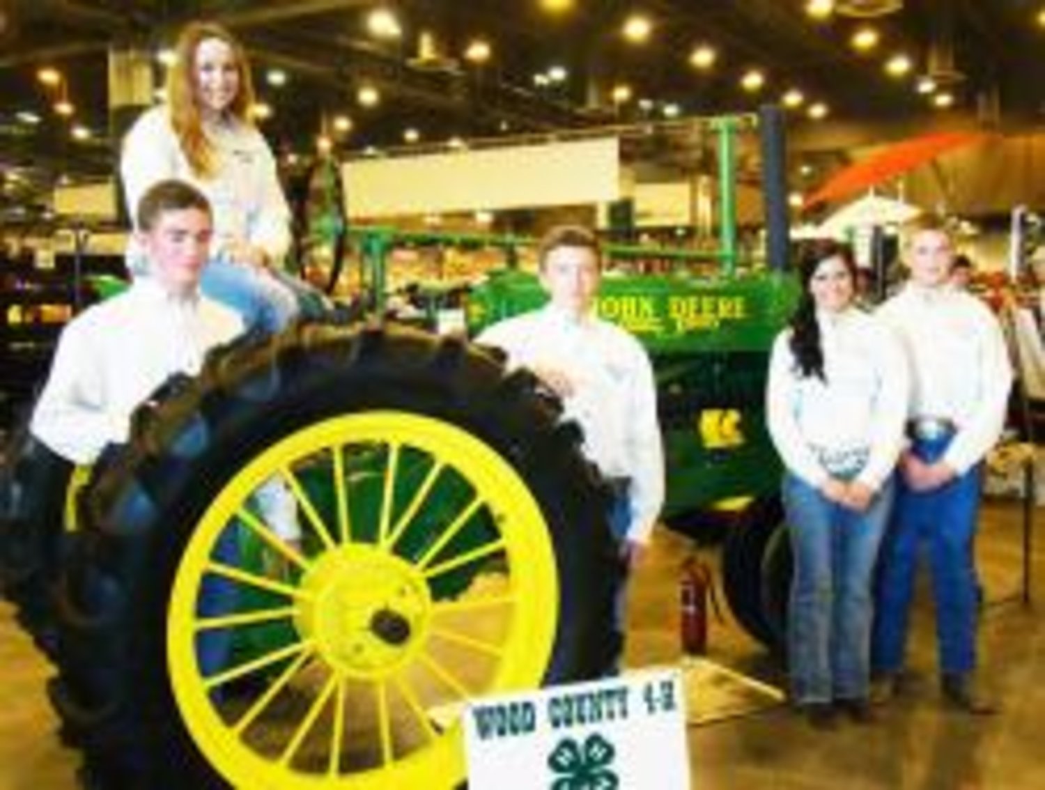 The Wood County 4-H Tractor Restoration Spin Club recently refurbished a John Deere tractor and showed it in Houston at the Ag. Mechanics Tractor Restoration Show. The club took home a blue ribbon. From left to right: Jake Kindle, Emilee Davis, Luke Kindle, Madison Nichols and Joel Rinlee.