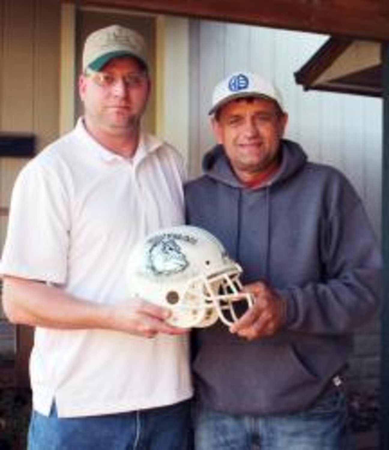 James Wood, president of the Quitman PeeWee Association, presented Quitman ISD's former head football coach and athletic director, Ron Callahan, with a special helmet. The helmet commemorates all the hard work Callahan put into the PeeWee Association to help it grow.