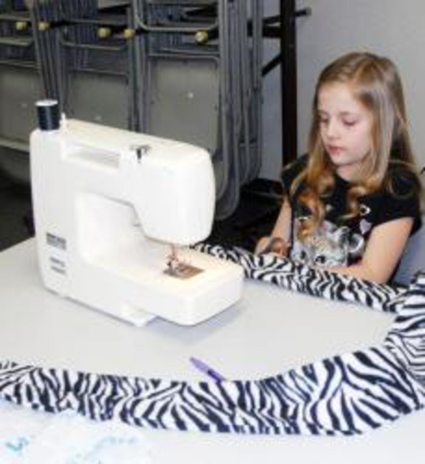 Pictured here is Mia Backer, a first-year member of the Quitman 4-H Club, who participated in the recent 4-H workshop where each member created their own fleece scarves. In addition to the traditional 4-H clothing construction or consumer buying projects, members can also enter the "Decorate a Shoe" contest and the new "Duct Tape Designs" contest.