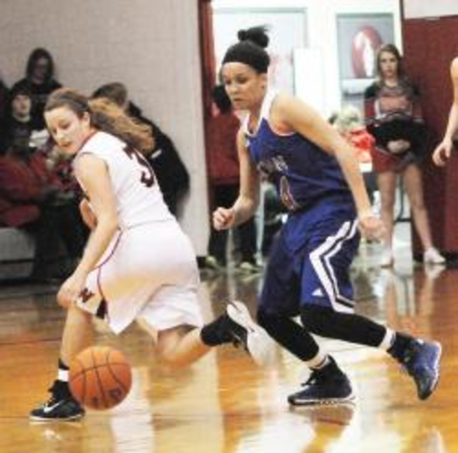 Quitman's Dawn Houck steals the ball from Winnsboro's Kelsey Green and scores early in the second quarter to get the Lady Bulldogs to within three points, trailing Winnsboro 14-11.