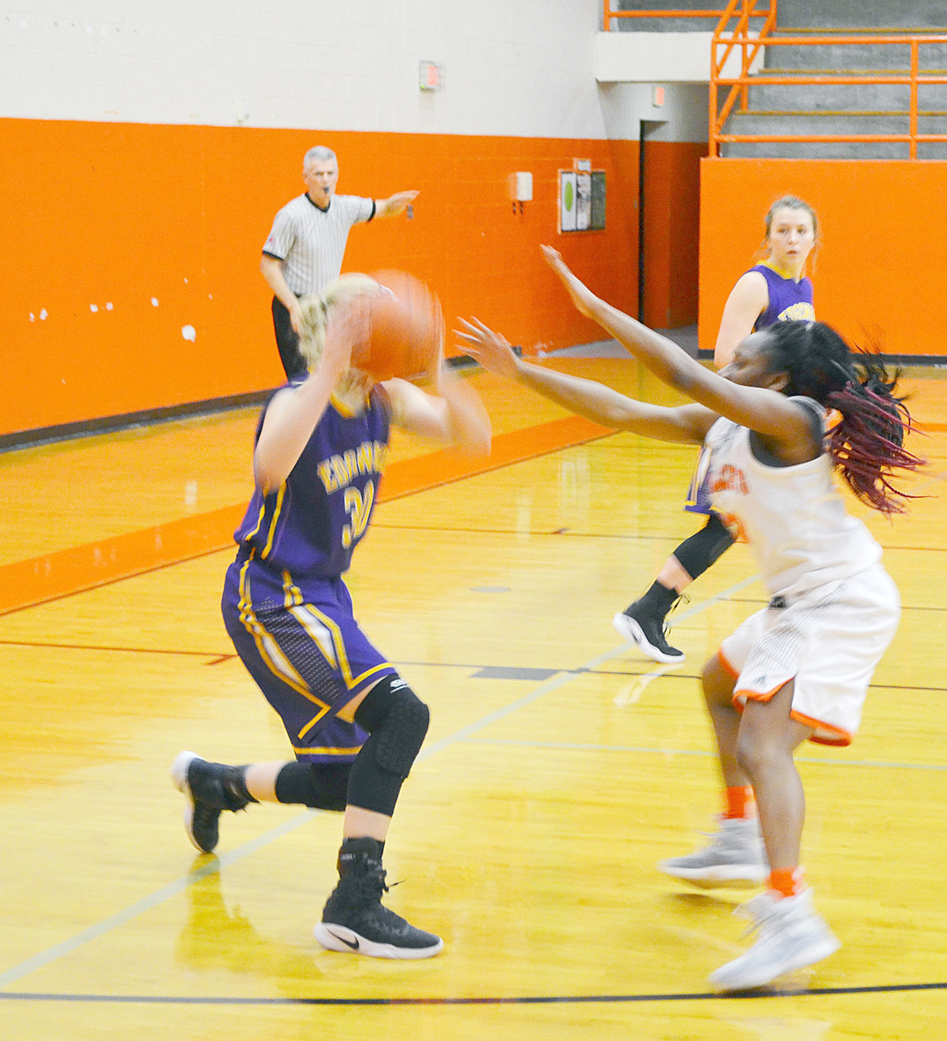 Jessiah Riley (12) plays defense against Edgewood in the Lady Jackets’ win Friday night. (Photo by Evan Dudley)