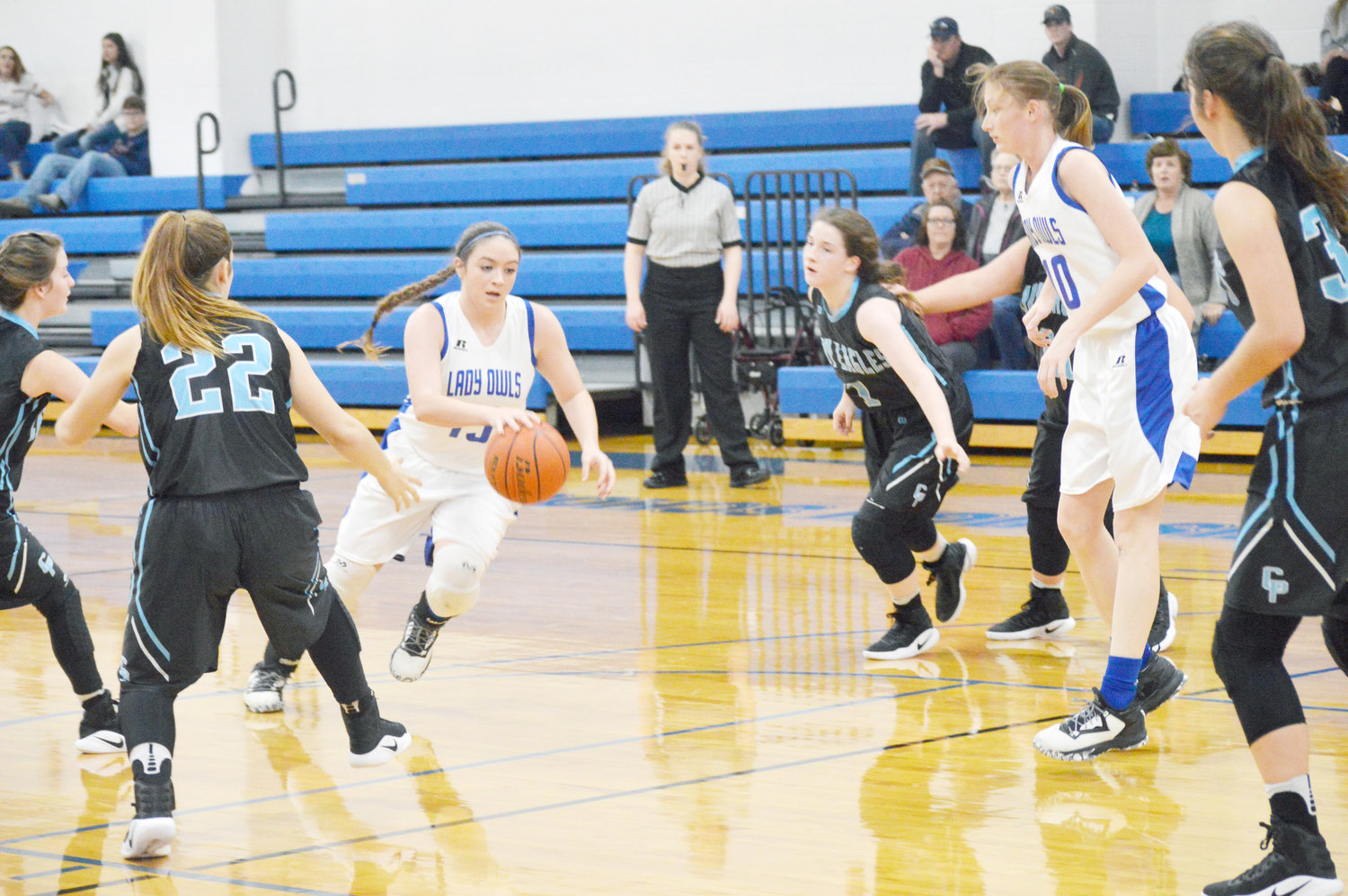 Yantis Lady Owls Montana Wetzel (15) drives to the bucket in their win over Como-Pickton. Also in the picture is teammate Maggie Hooker (10). (Photo by Larry tucker)