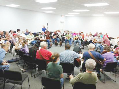 The fifth anniversary of the second Friday Acoustic Jam at Quitman Library is Friday. The session attracts anywhere from 35 to 100 people, some to play and others just to enjoy the music of others. (Monitor photos by Larry Tucker)