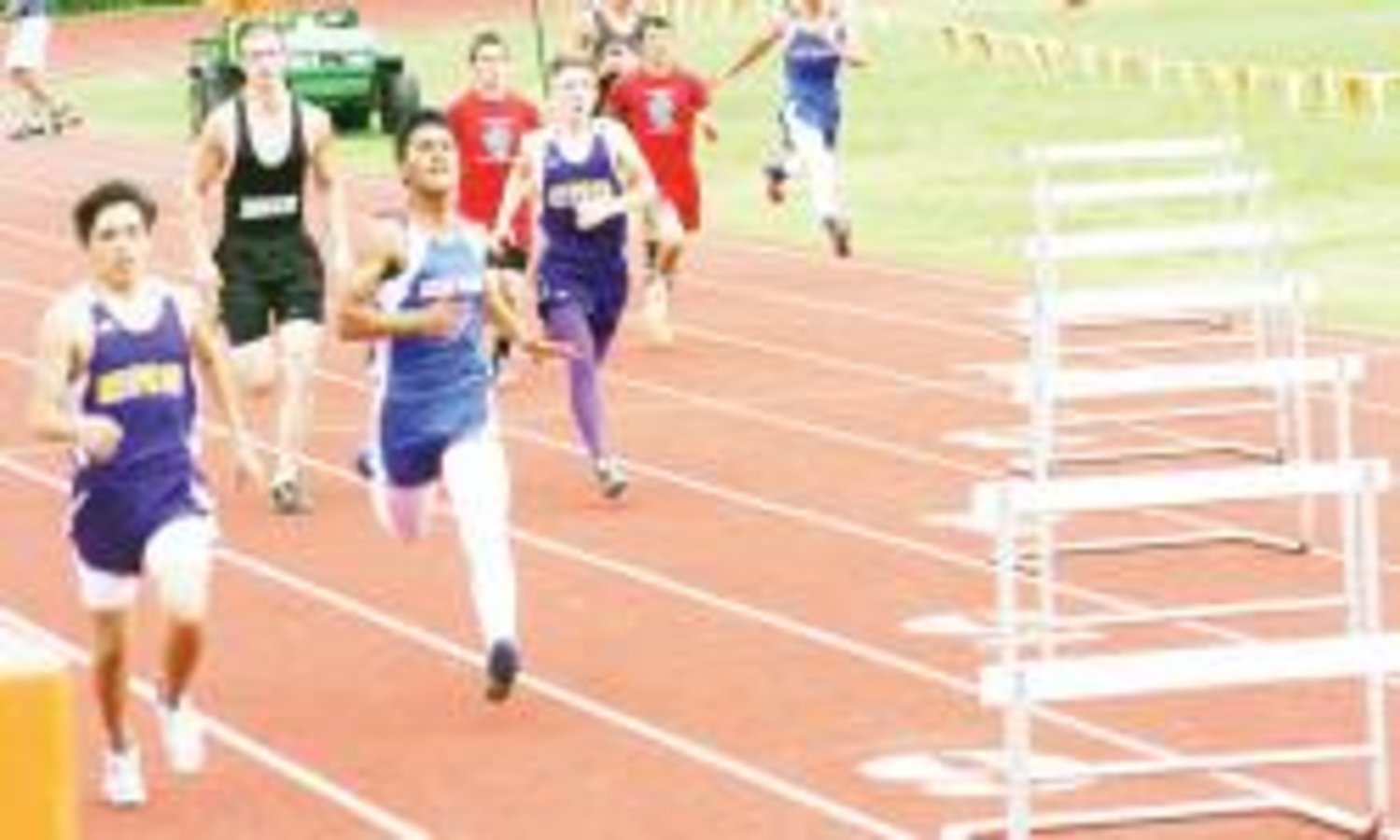 Fabian Roman of Quitman gets ready for one more hurdle at the district meet last week in Mineola.