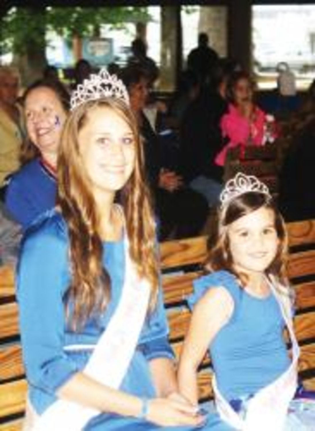 Newly crowned Miss Junior Dogwood Aleigh Farnham and Little Miss Dogwood Hannah Gilbreath began their duties last Tuesday at the candlelight service commemorating April as "Child Abuse Prevention Month."