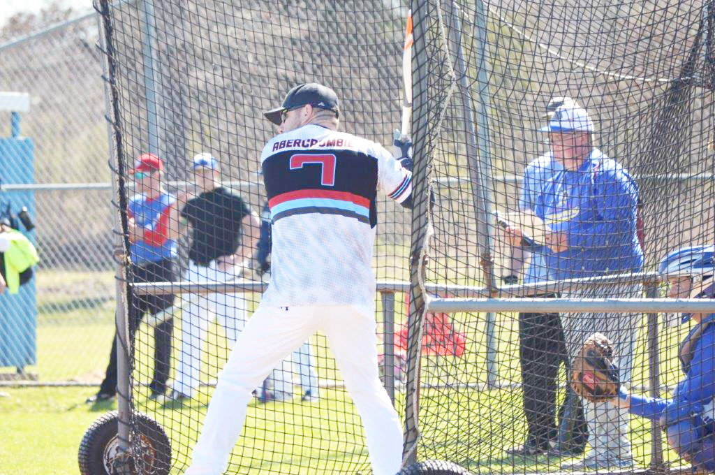 A Quitman businessman gets ready to take a swing during the annual Quitman Alumni Game activities at Tom Brady field Saturday.