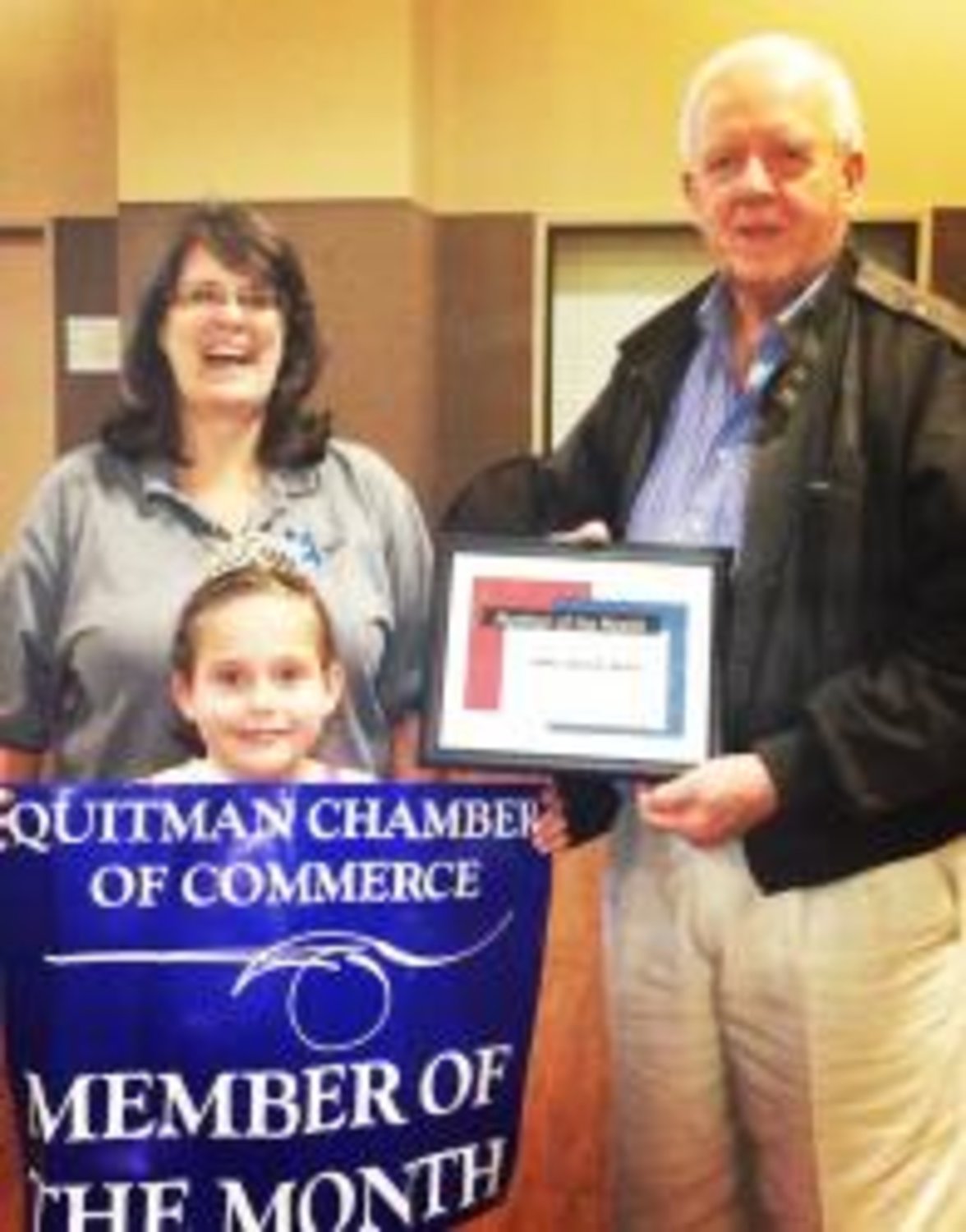 The Quitman Chamber of Commerce selected Lowe Funeral Home as their member of the month. Dary Steinburg, advertising and marketing representative for Lowe Funeral Home, poses with 2012 Little Miss Dogwood Queen Irelynn Felty and Robin Johnson, a director on the chamber's board.