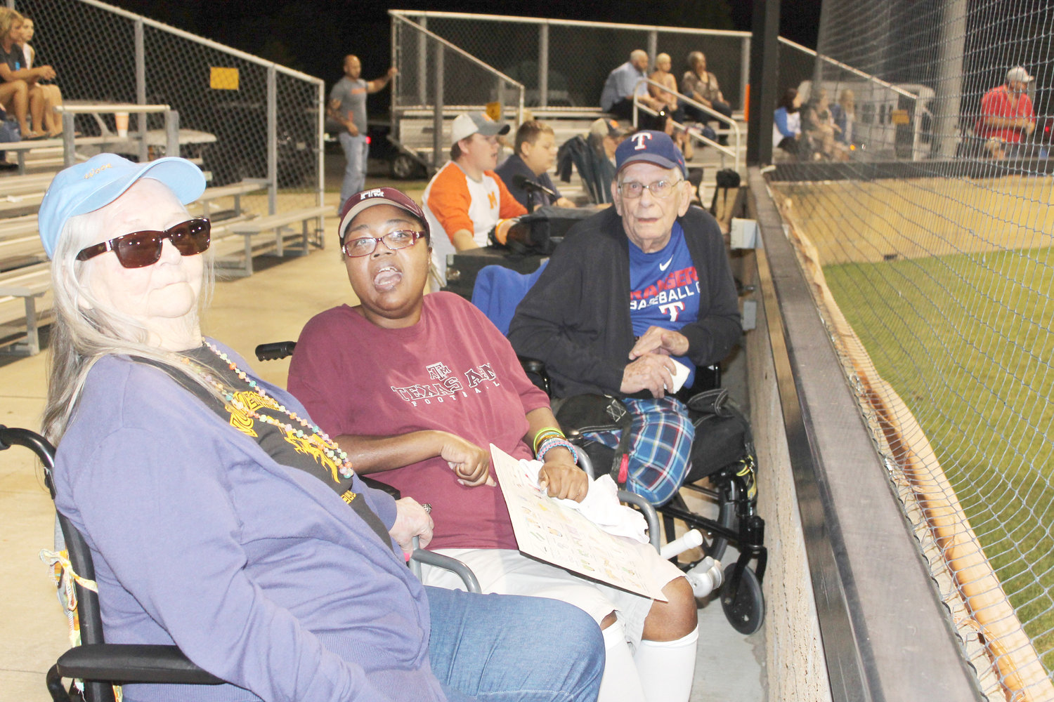 Seasoned baseball fans from Wood Memorial Nursing Home had a field trip to the Mineola versus Quitman baseball game in Mineola last Tuesday. Shown are, from left, Mary Winnett, Sharon Lewis and Doug Myers. They were taken to the game by Activity Director Mary Hall and Staffing Coordinator Amanda Walters. Hall said when she arrived at the home first thing that morning the fans were already ready to go to the game. (Monitor photo by Doris Newman)