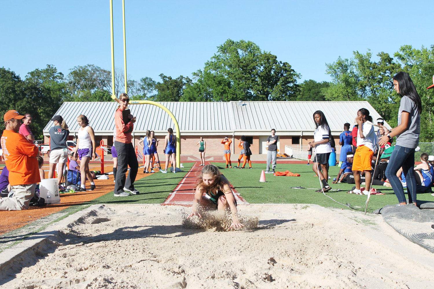 A Canton competitor digs deep for her landing in the Long Jump in Thursday’s track meet in Mineola.