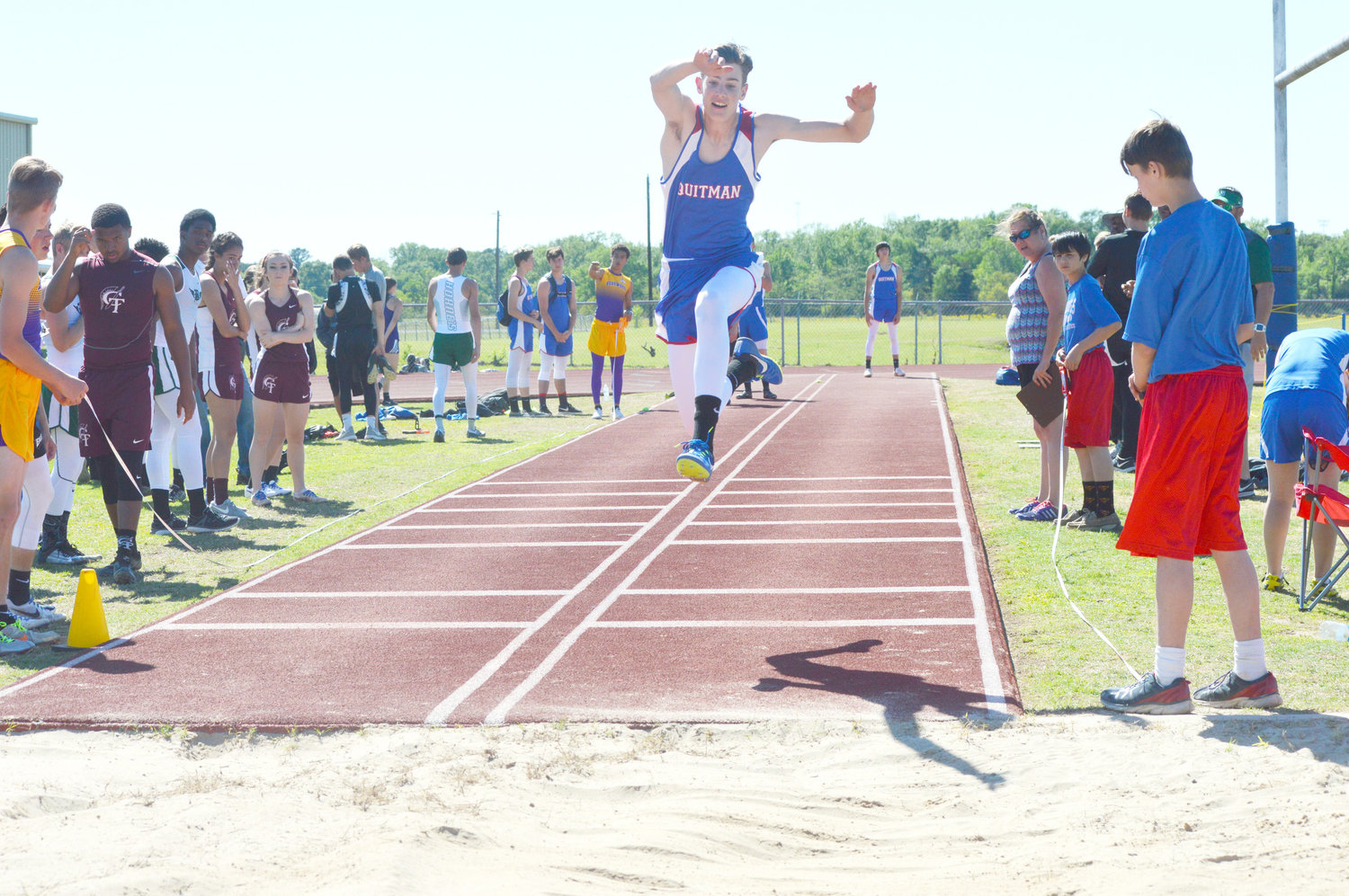 Quitman’s Riley Flanagan works hard in the triple jump competition at the Quitman Relays Thursday.