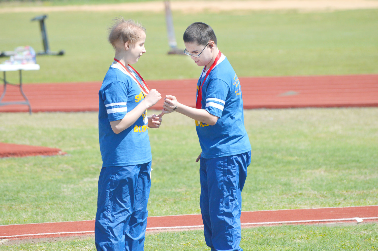Teammates from Sulphur Springs congratulate each other on a job well done in the softball throw at Friday’s Special Olympics held at Quitman High School.