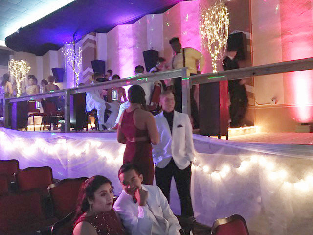 Students gather on the platforms built by Kiwanis Club members and MHS junior and senior students on each side of the theater that replicated terraces in big city clubs. The interior of the theater was transformed by the prom decoration committee.