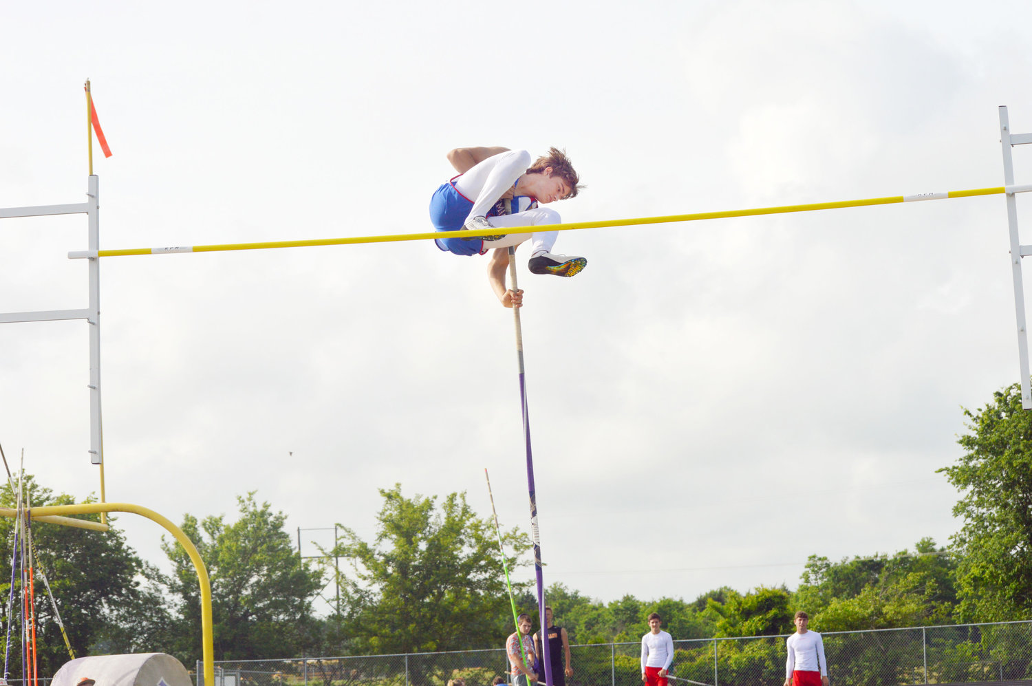 Quitman’s Langdon Bautista flies over the bar during the pole vault competition at the district track meet last week. (Monitor photo by Larry Tucker)