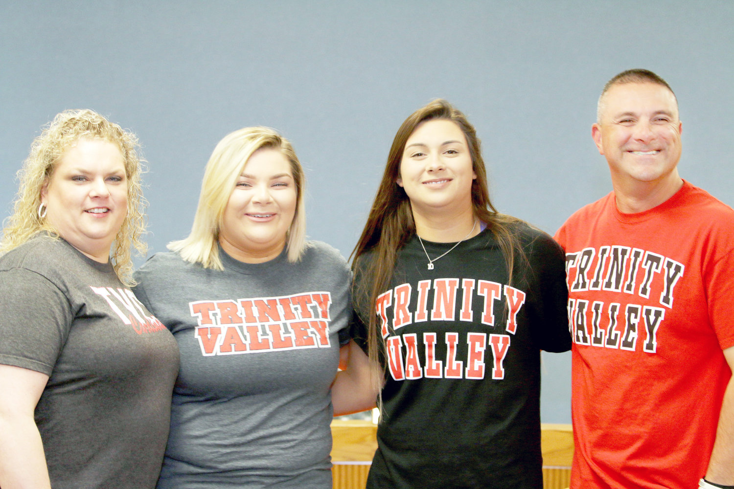 Mineola High School Senior Lauren Almuete signed her letter of intent to play volleyball at Trinity Valley Community College Thursday morning. She is shown with, from left, her mother Winona Almuete, sister Brooke Almuete and her father, Stephen Almuete. (Photo courtesy Tristan Mosher)