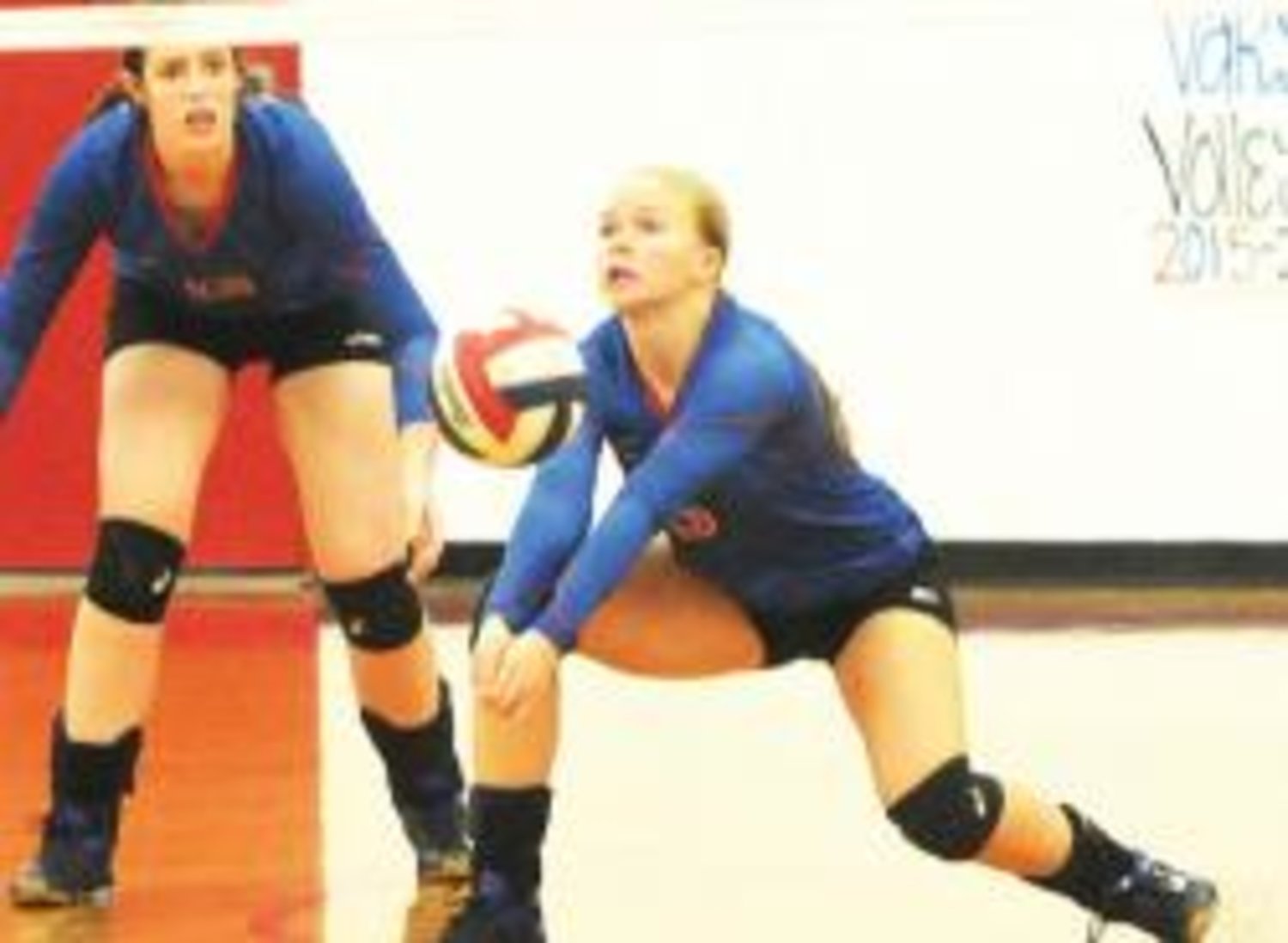 Madalyn Spears makes a save during the volleyball action at Alba-Golden.