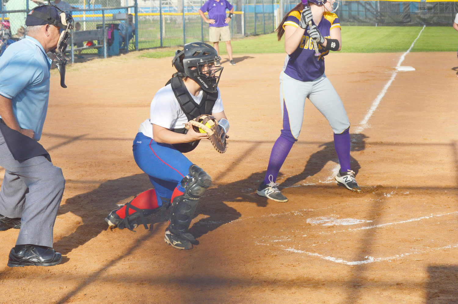 Quitman’s Shayla Smith gets ready to fire a throw to first base in a pick-off attempt against Edgewood. The Lady Bulldogs finished their season with wins over Eustace and Edgewood last week.