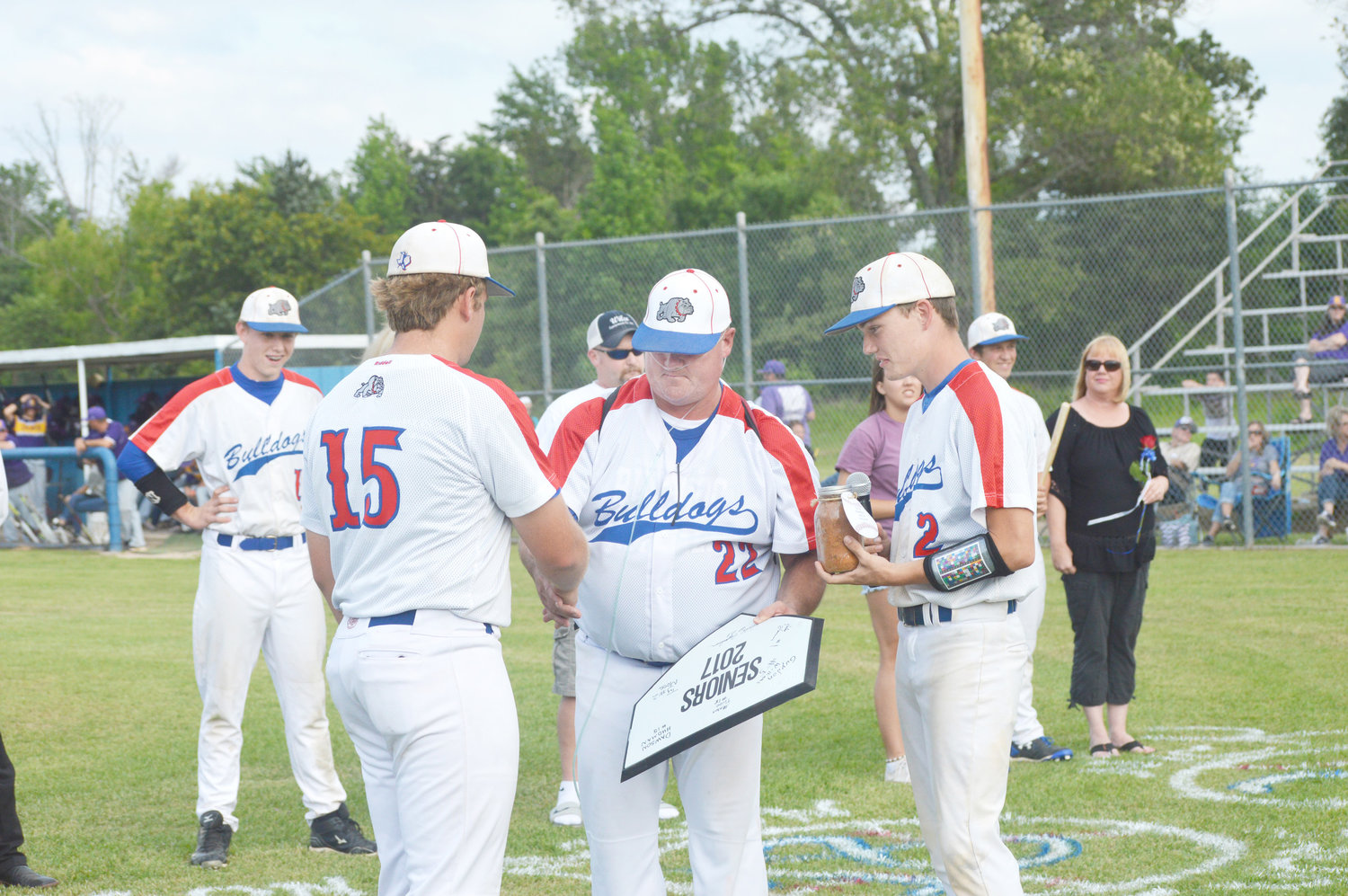It was Senior Night last Tuesday at Tom Brady Field. Quitman Head Baseball Coach Hayland Hardy received a home plate signed by his senior baseball players from Dawson Hudman. Ty Moss gave the long time coach a jar of dirt from the infield at Brady Field. Quitman fell to Edgewood is the final district game of the year. (Monitor photos by Larry Tucker)