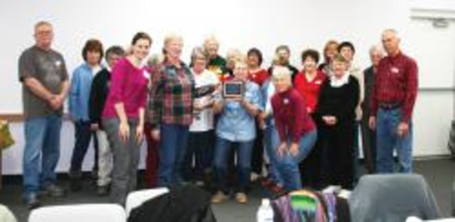 The Quitman Garden Club was selected to receive the Public Service award at the Quitman Chamber of Commerce membership banquet held January 31. Chamber directors Macie Rushing and Judith Sanders (front left to right) presented the plaque to the Garden Club members last Tuesday at the Quitman Public Library.