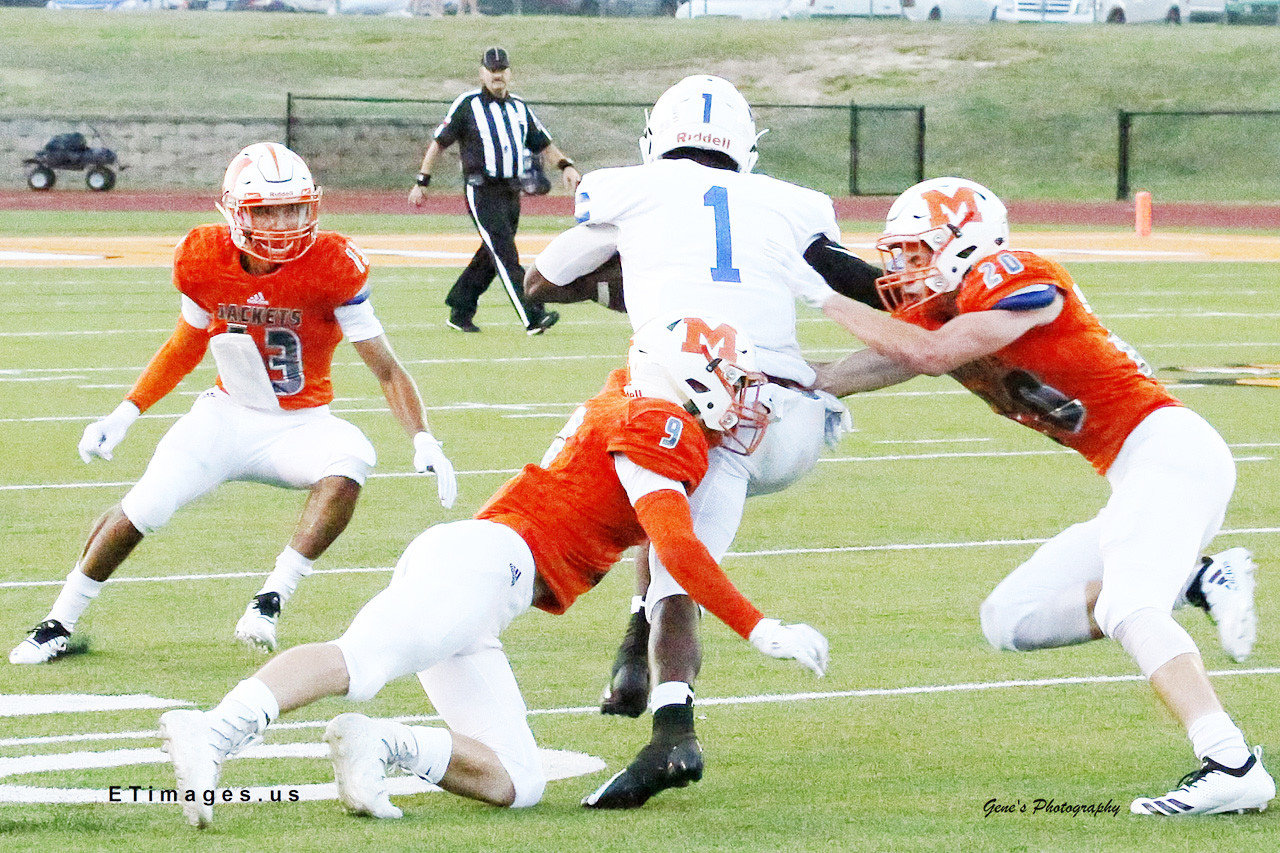 Cole Castleberry (9) and Wylie Franks (20) play great defense in Mineola’s 42-14 win over wills Point.