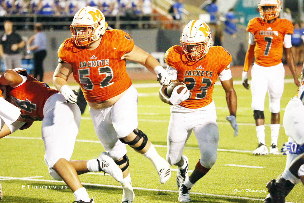 Mineola’s Trevion Sneed (23) follows the blocking of Cameron Eise (52) got a good gain in Friday’s win over Wills Point.