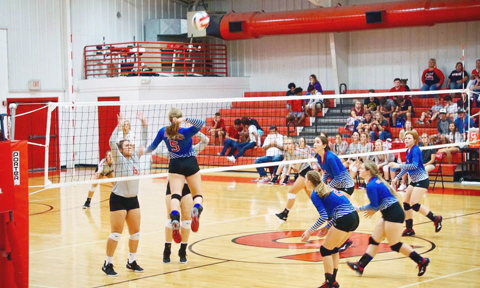 Quitman’s Madalyn Spears goes up high to claim one of her 11 kills in the Lady Bulldogs district opening win at Lone Oak.