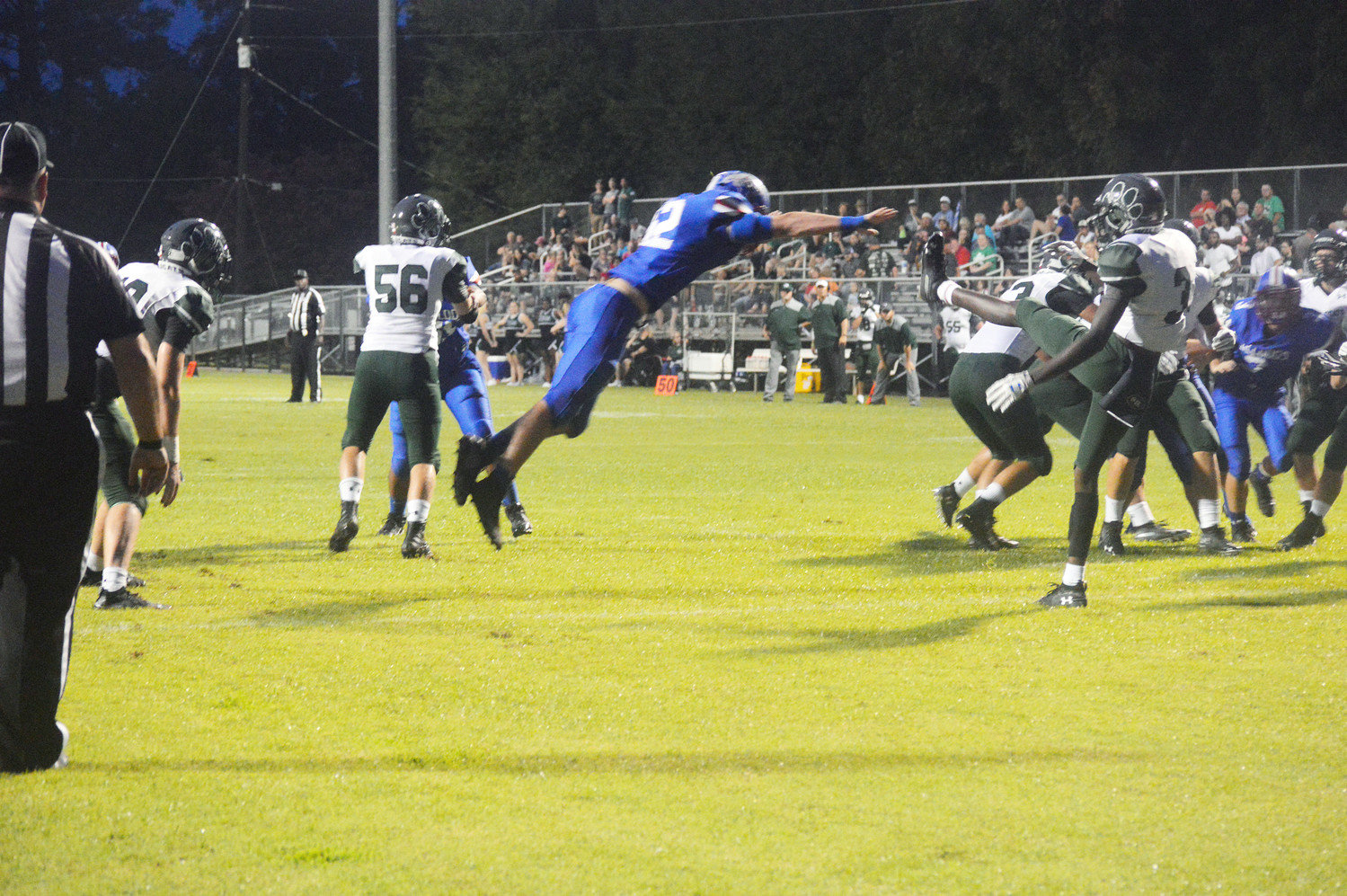 A Quitman Bulldog comes close to blocking a punt by Scurry-Rosser in Friday’s weather plagued football game.