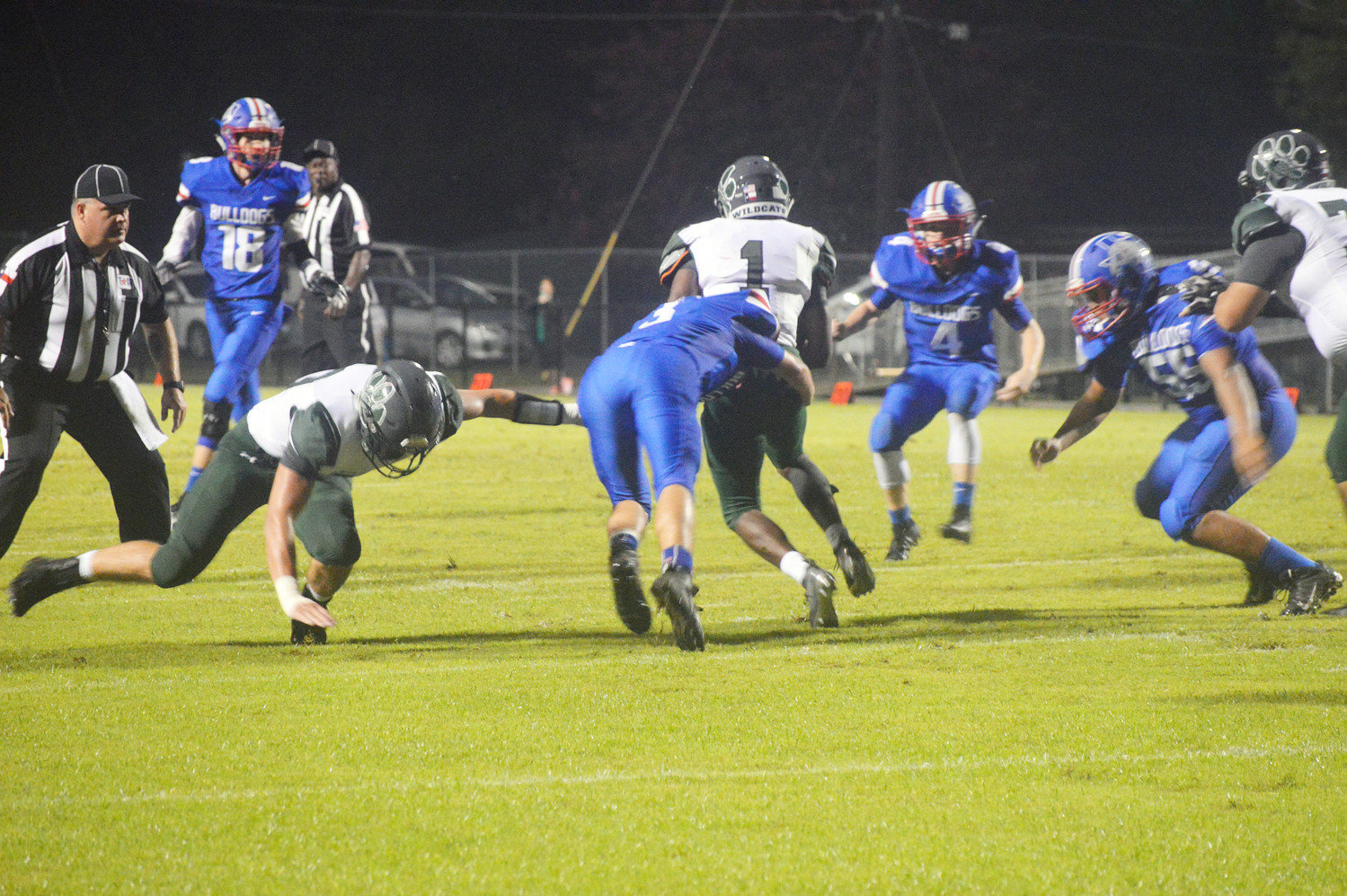 Quitman’s River Chaney (3) brings down Scurry-Rosser’s Marquis Majors (1) in Friday’s contest prior to the game being called because of lightning in the area.