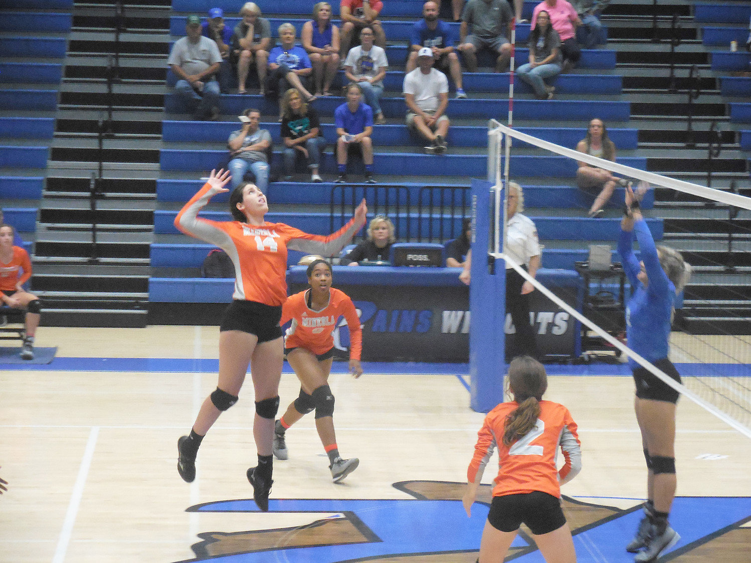 Mineola’s Audrey Dowdle goes up for a kill at Rains in a district game last Friday. (Monitor photos)