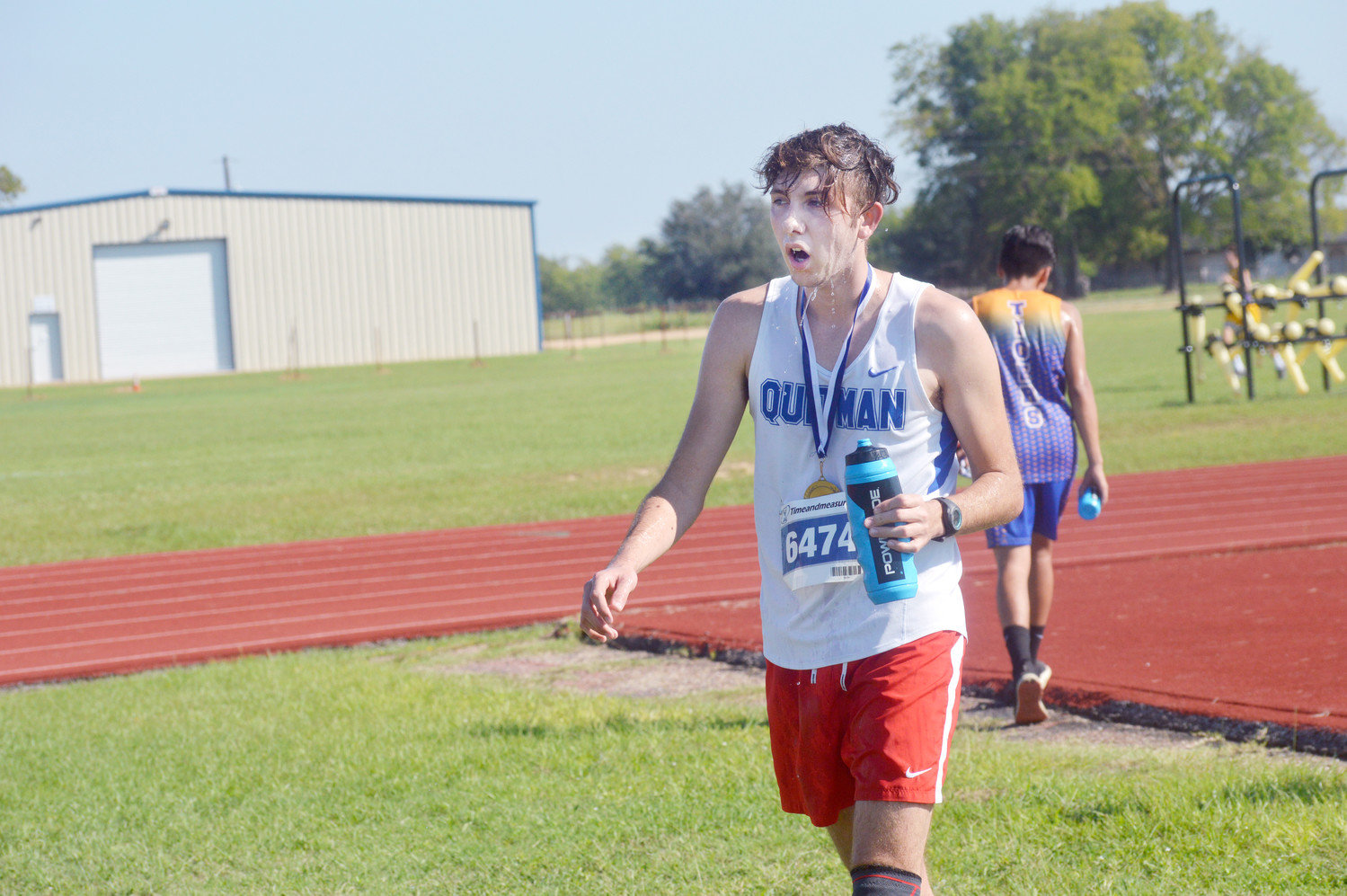 Dalton Brandon cools off after his 10th place finish at the Quitman Cross Country Meet last Thursday.