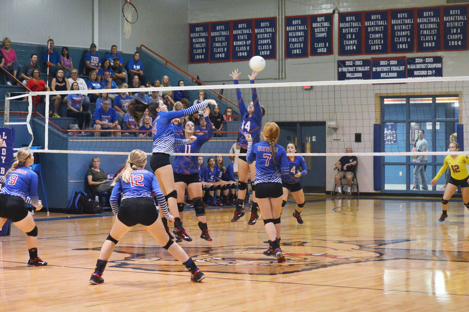 Ava Burroughs (14) sends a kill shot over Alba-Golden’s Macie Pendergrass (14) in last Tuesday’s match at Quitman.