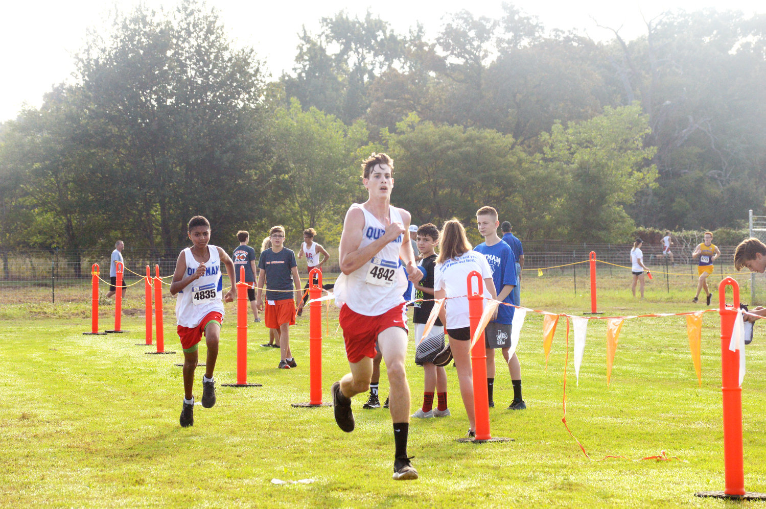 Quitman’s Riley Flanagan finishes strong at the district cross country meet Saturday.