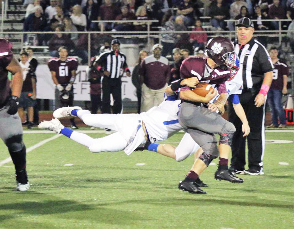 Quitman’s Mason Reynolds (7) makes a big stop in his varsity debut against Troup Friday night.