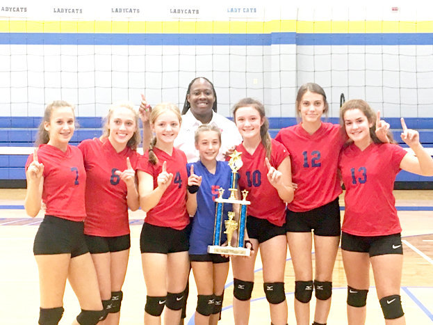 The Alba-Golden Junior High eighth grade team recently won the big Sandy Tournament, beating Hawkins, Union Grove and Jefferson while never losing a set. They are (left to right) Skyler West, Savanna Smith, Cacie Lennon, Kamrin Wright, Carlee Dooley, CrimsonBryant and Jessie Mithcell. Standing behind them is Coach TaShara Everett.
