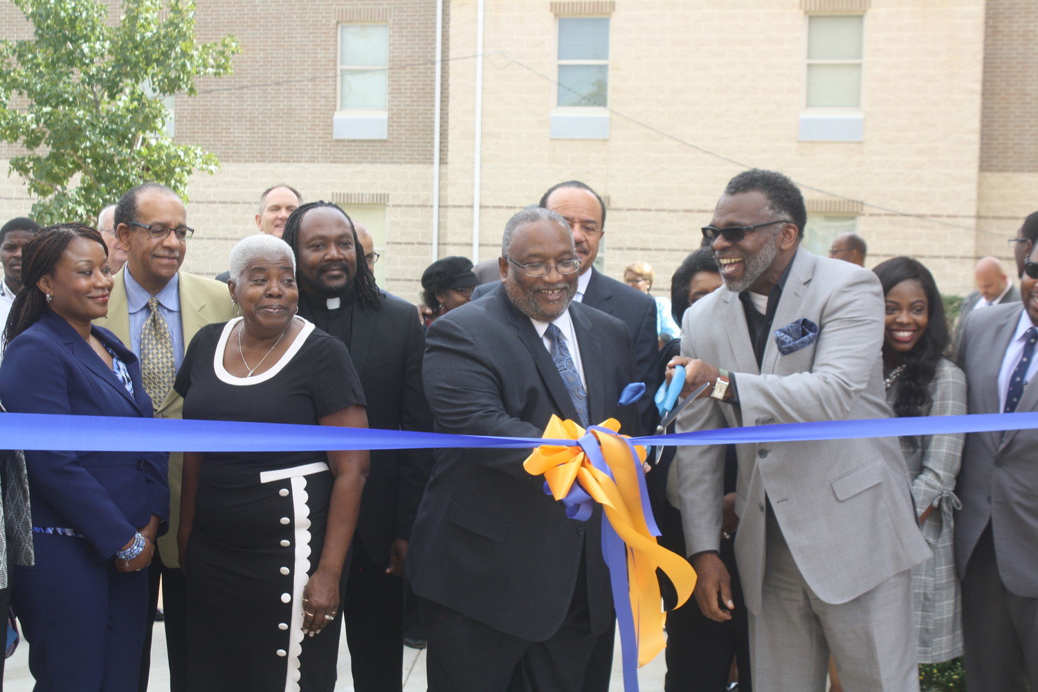 Jarvis Christian College President Dr. Lester C. Newman (left) and Jarvis board of trustees chair and Terrell city manager Reverend Torry L. Edwards  (right) perform the ribbon cutting ceremony to celebrate the opening of the two new residential halls on Oct. 12.