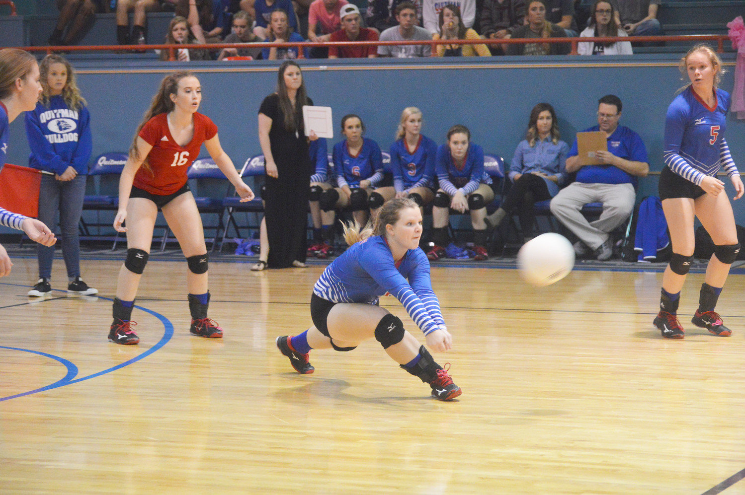 Lady Bulldog Abby Dobbs digs deep on a serve from Mineola in Quitman’s district over Mineola. The Lady Bulldogs begin the state playoffs next week.  (Monitor photo by Larry Tucker)