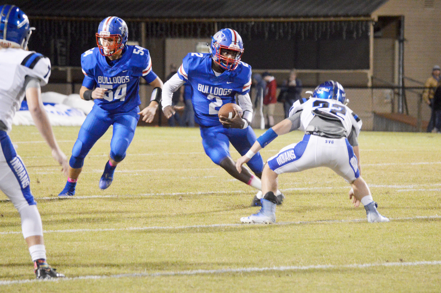 Quitman’s Trey Berry (2) picks up yardage against Frankston last Friday. Berry rushed for 336 yards in the Bulldogs loss to the Indians. (Monitor photo by Larry Tucker)
