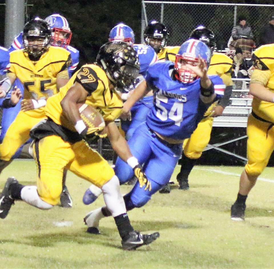 Senior Quitman Bulldog defender David Tarno flies in to make a defensive play in Friday’s game against Winona. (Photo by Sheree Phillips)
