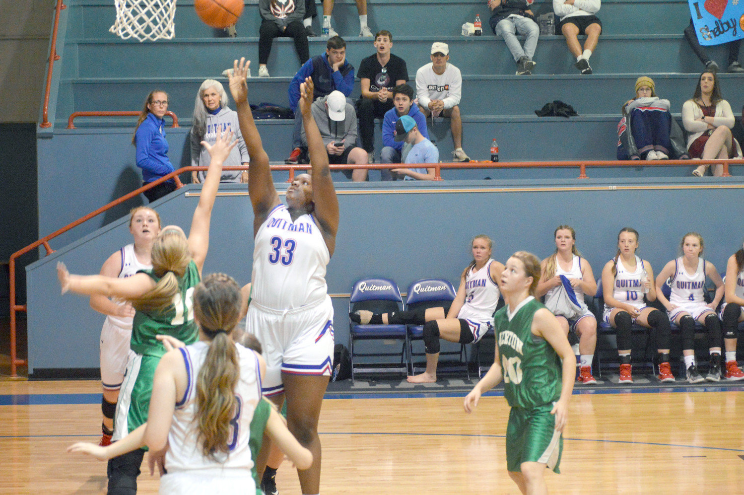 Lady Bulldog Utopia Henry score two points in Quitman’s 54-32 win over Overton Saturday evening.   (Monitor photo by Larry Tucker)