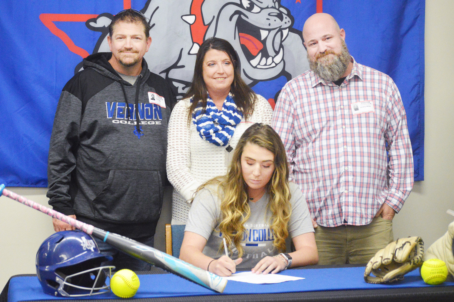 Quitman High School softball star Kendal Wiley signed a national letter of intent to play collegiately at Vernon College. She is pictured here with her parents (left to right) Tyron Hale (step-father), Haley Hale (mother) and Jeremy Wiley (father).