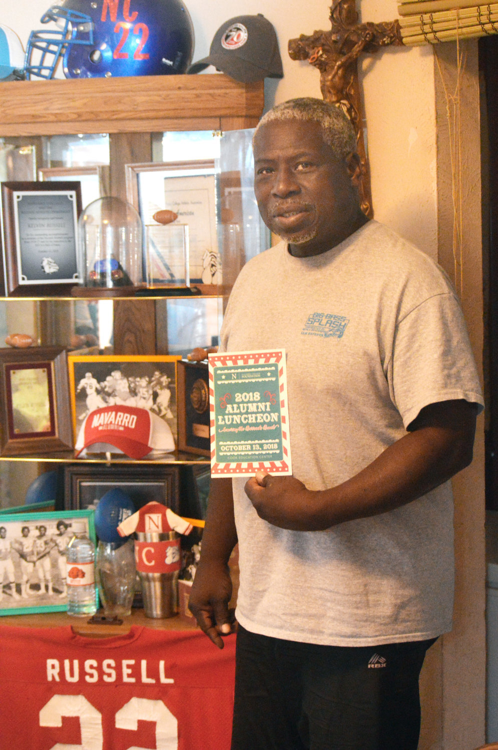 Kelvin Russell  is shown in his home with memorabilia he has collected from his football endeavors in high school and college. (Monitor photo by Larry Tucker)